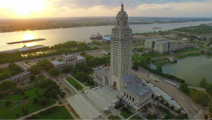 0023 dramatic drone aerial louisiana state capital wide shot at sunset