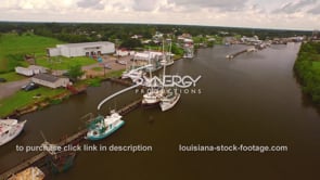 0104 Aerial drone view of shrimp boats docked on the bayou