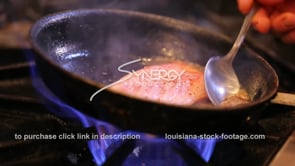 0370 chef cooking and sauting redfish in pan