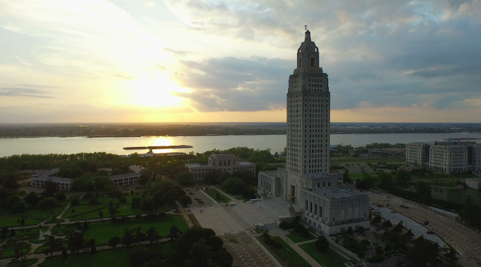 0014 Louisiana State Capitol aerial drone out to sunset 1