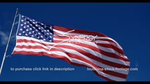1274 proud american flag blowing in breeze
