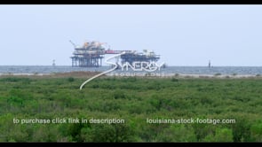0549 Louisiana oil gas rig platform seagull flying around oil rig