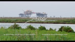 0550 oil rig gas platform on Louisiana Coast beach