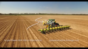 0688 CU aerial drone following farmer planting seeds