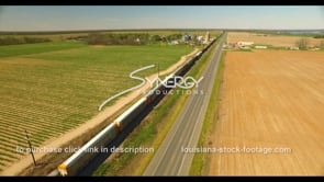 0694 aerial view train delivering goods American farmland
