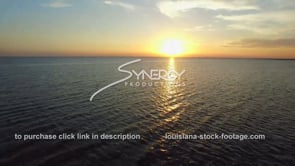 0034 epic lake pontchartrain sunset aerial drone tilt up into awesome sunset