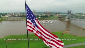 0086 Cool drone ascent American-flag to Alexandria downtown skyline 3