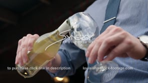 0389 Nice angle server pouring glass of wine