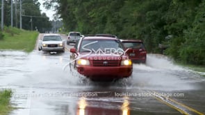 0361 vehicles drive through flood water