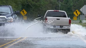 0360 trucks driving thru flooded highway road