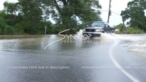 0359 truck driving raging rushing flood water across highway