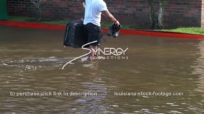 0346 man with suitcase in flooded apartment