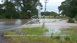0345 flood water rushing over Louisiana highway