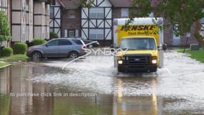 0274 truck driving thru flood water at flooding apartment