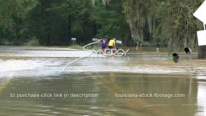 0322 CU couple walking thru raging flood water