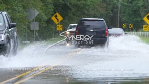 0325 suv cars driving on flooded river flooded roadway