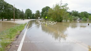 0327 WS pan to submerged roadway from flooding river rain overflow