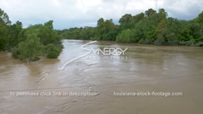 0339 hurricane windy conditions tilt down to raging flooding river