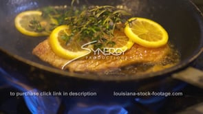 1887 Fresh seafood fish in pan getting sautéed by chef