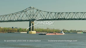 1940 barge under a bridge on Mississippi River
