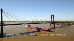 2022 Epic aerial crude oil tanker sails under bridge on Mississippi river