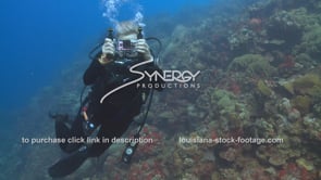 2103 female scuba diver with go pro camera underwater