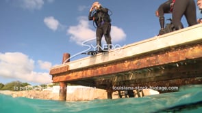 2107 scuba diver jumps of dock dive platform
